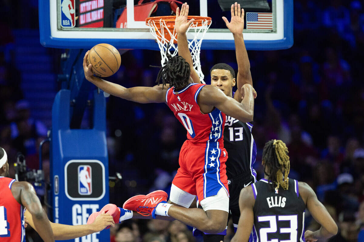 Philadelphia 76ers guard Tyrese Maxey (0) drives for a score against Sacramento Kings forward Keegan Murray (13) on Friday at Wells Fargo Center in Philadelphia.