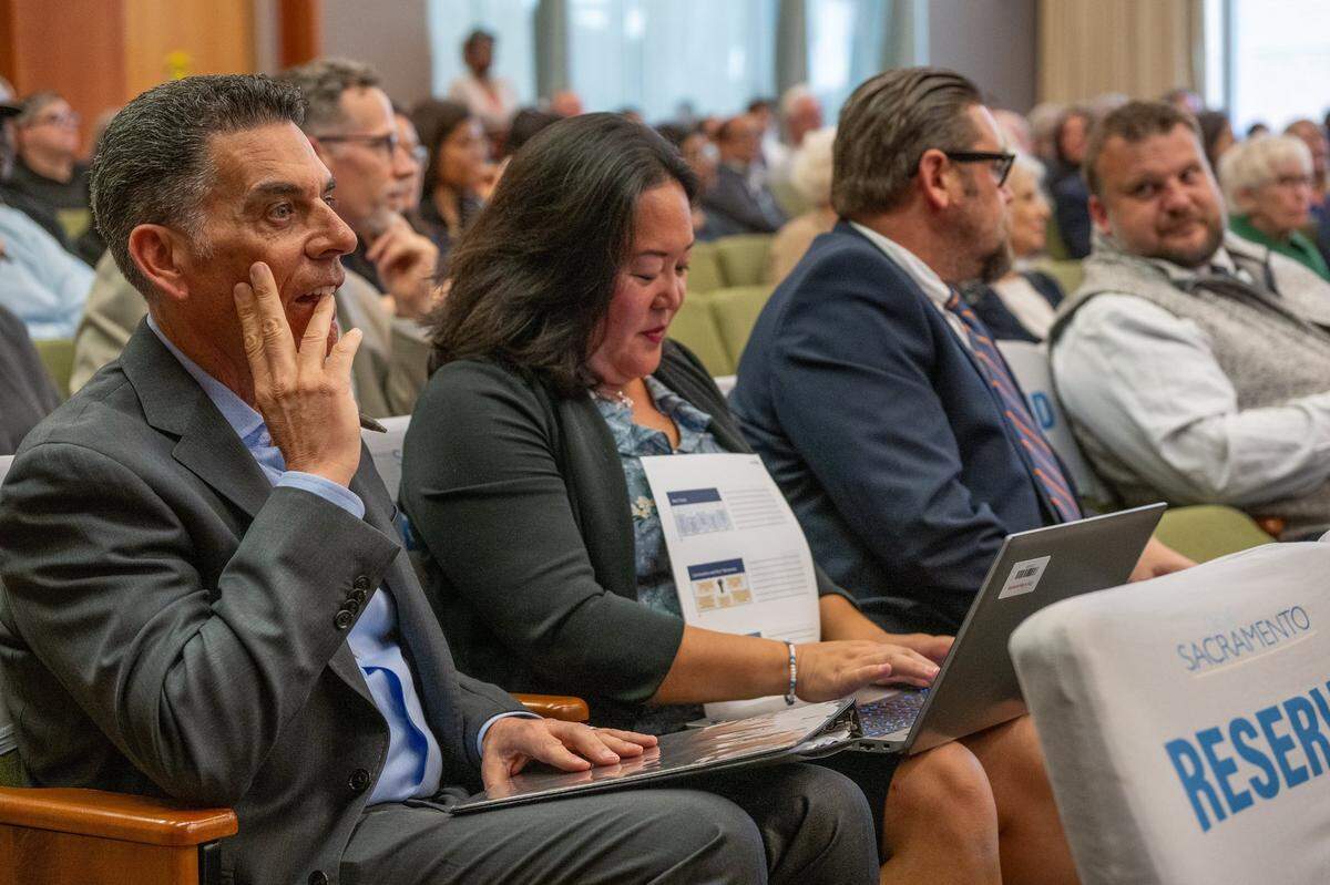 Brian Pedro, left, director of Sacramento’s Department of Community Response, waits to present at a homelessness workshop at City Hall in April.