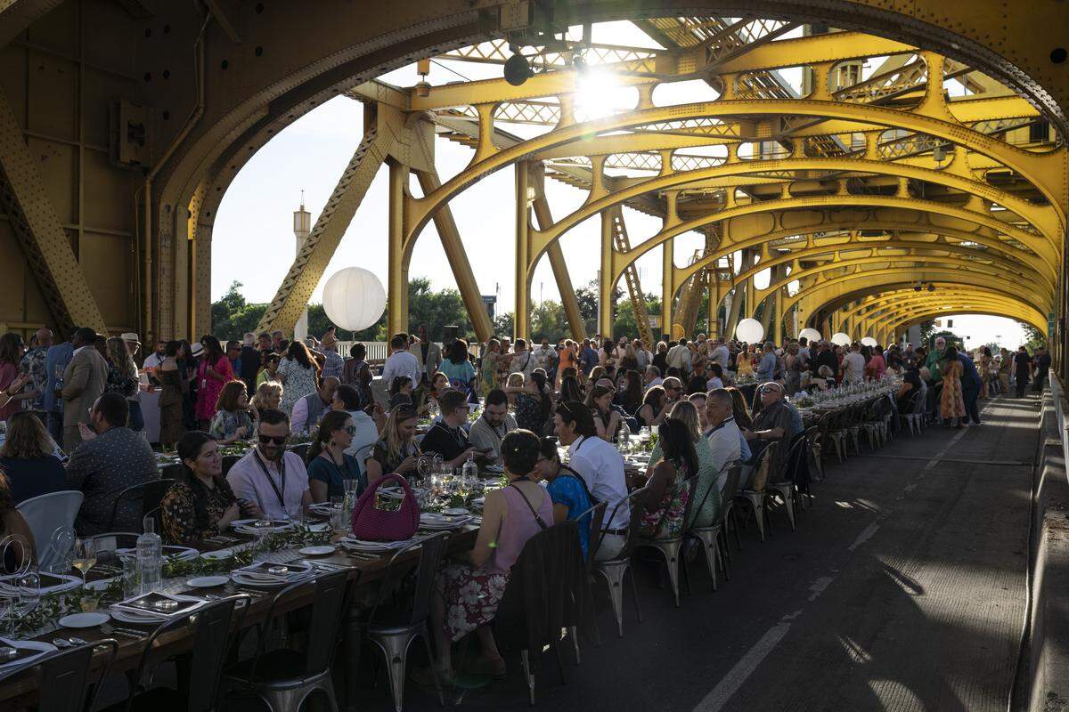 Guests dine on Tower Bridge during the Tower Bridge Dinner on Sunday, Sept. 7, 2025.