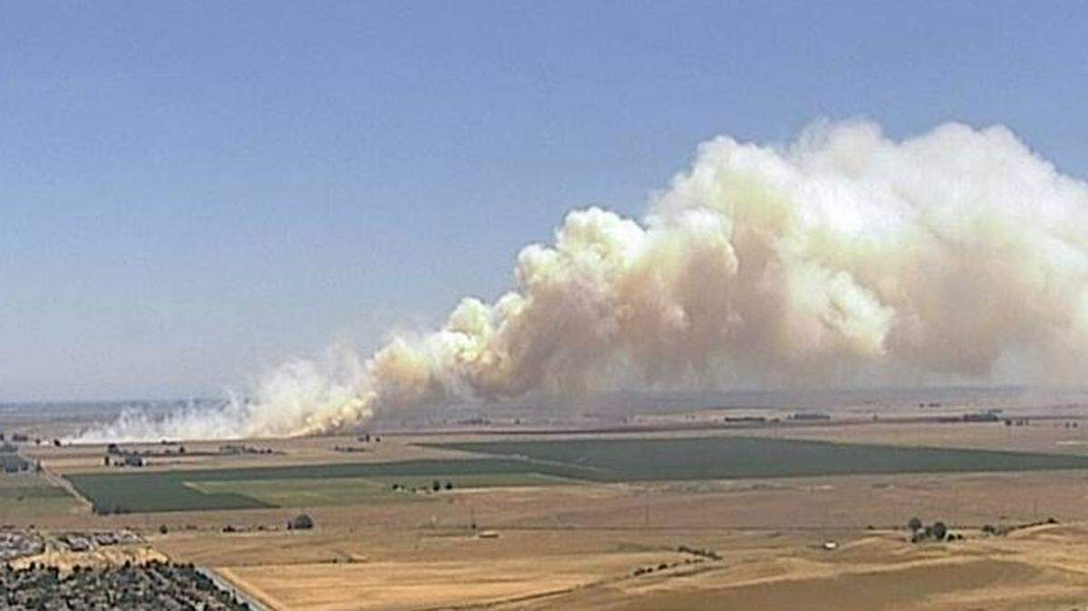 A fire near Highway 113 and Hay Road in Solano County created a large plume of smoke on Tuesday, May 31, 2022. County emergency officials said no structures were threatened.