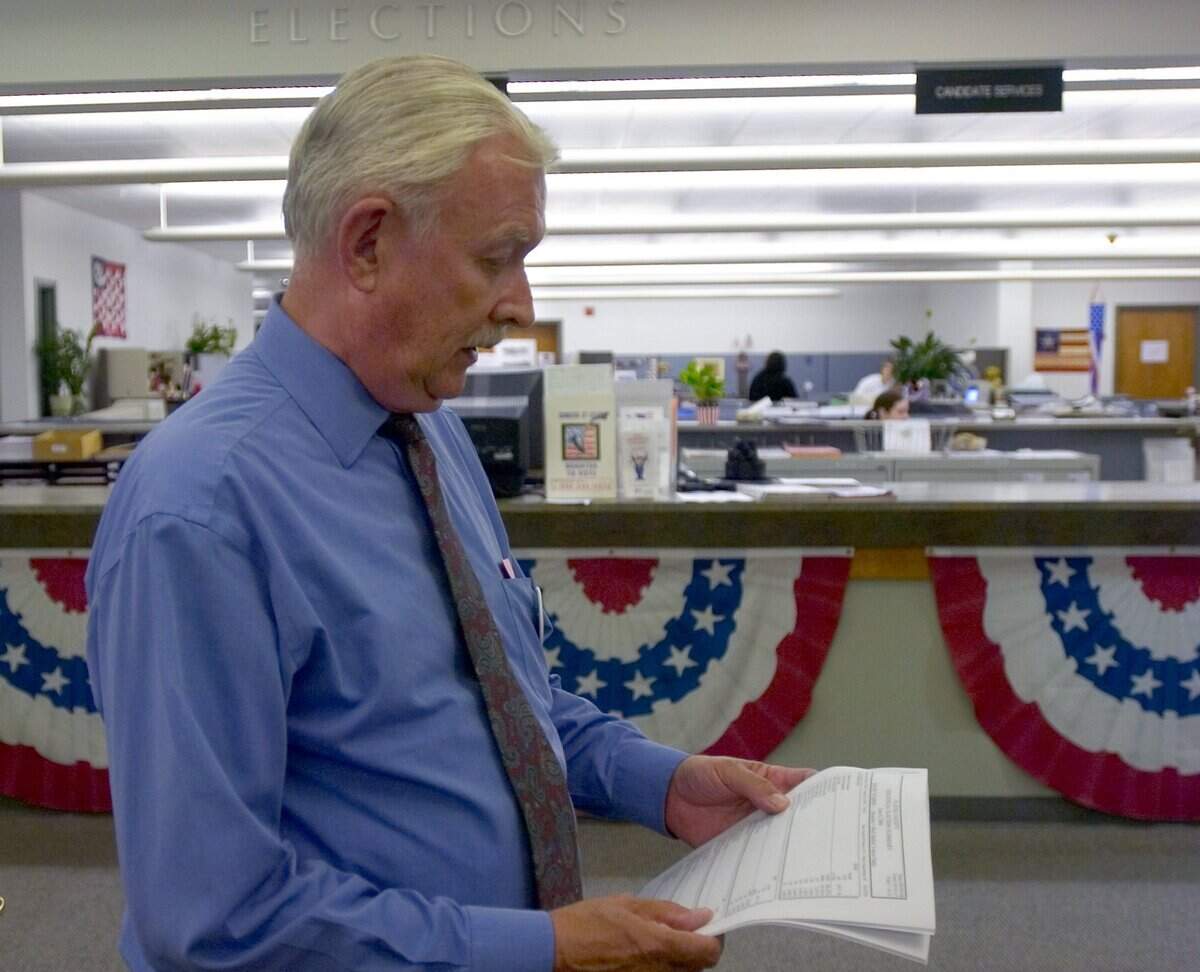 Auburn Mayor Mike Holmes looks over election results on June 6, 2006, at the Placer County Department of Elections. Holmes lost to Republican John Doolittle for the 4th Congressional District.