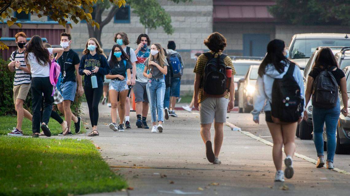 Masked groups of students entered the Rocklin High School campus on Monday, Sept. 21, 2020. The school district in February 2022 voted to stop enforcing California’s mask mandate for in-person learning.