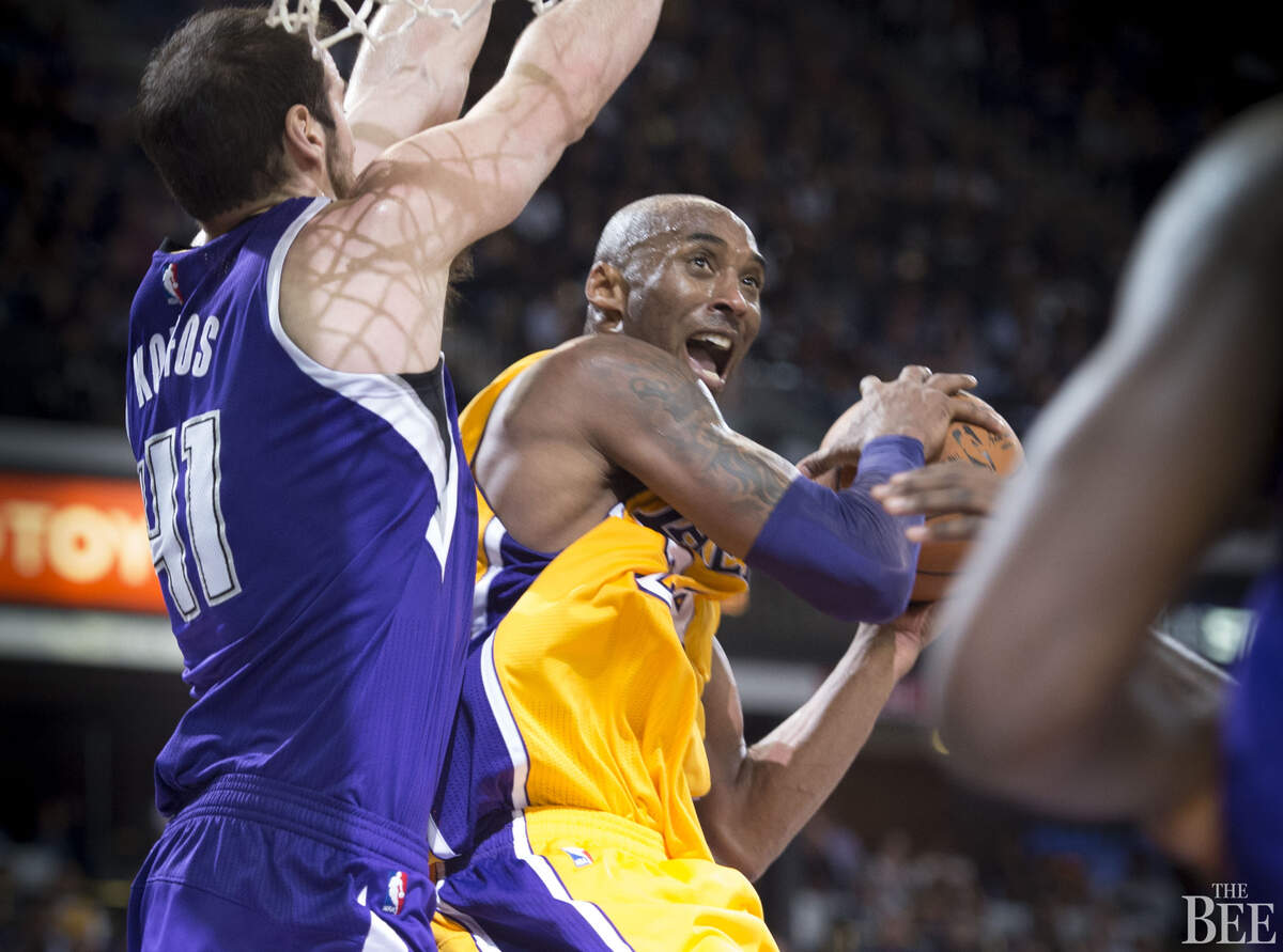 Sacramento Kings center Kosta Koufos (41) defends Los Angeles Lakers forward Kobe Bryant (24) during his final play at Sleep Train Arena.