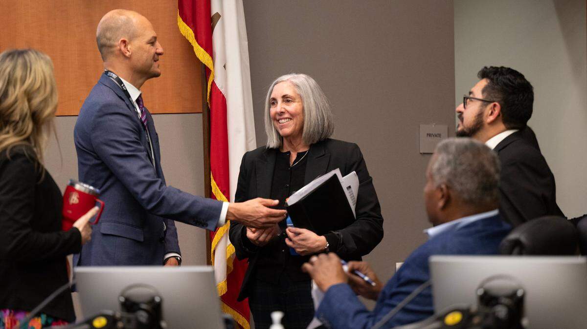 Leyne Milstein, center, talks with Sacramento Mayor Kevin McCarty, and council members Eric Guerra, Caity Maple and Rick Jennings after she was selected by the council to be the interim city manager on Tuesday, Jan. 7, 2025, at Sacramento City Hall.