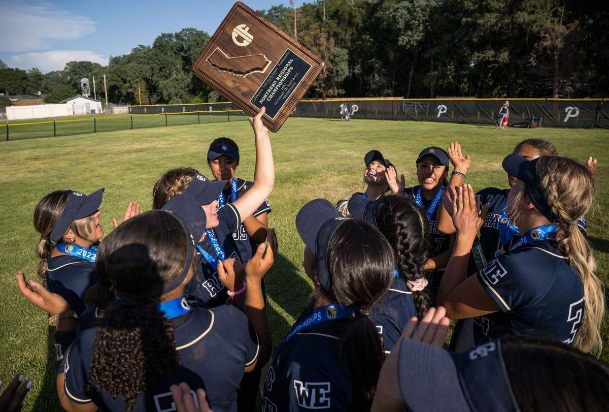 The Central Catholic Raiders hold up their CIF Northern California Division III softball championship plaque Saturday, June 3, 2023, at Ponderosa High School in Shingle Springs. The Raiders beat the Bruins, 7-0, for the title.