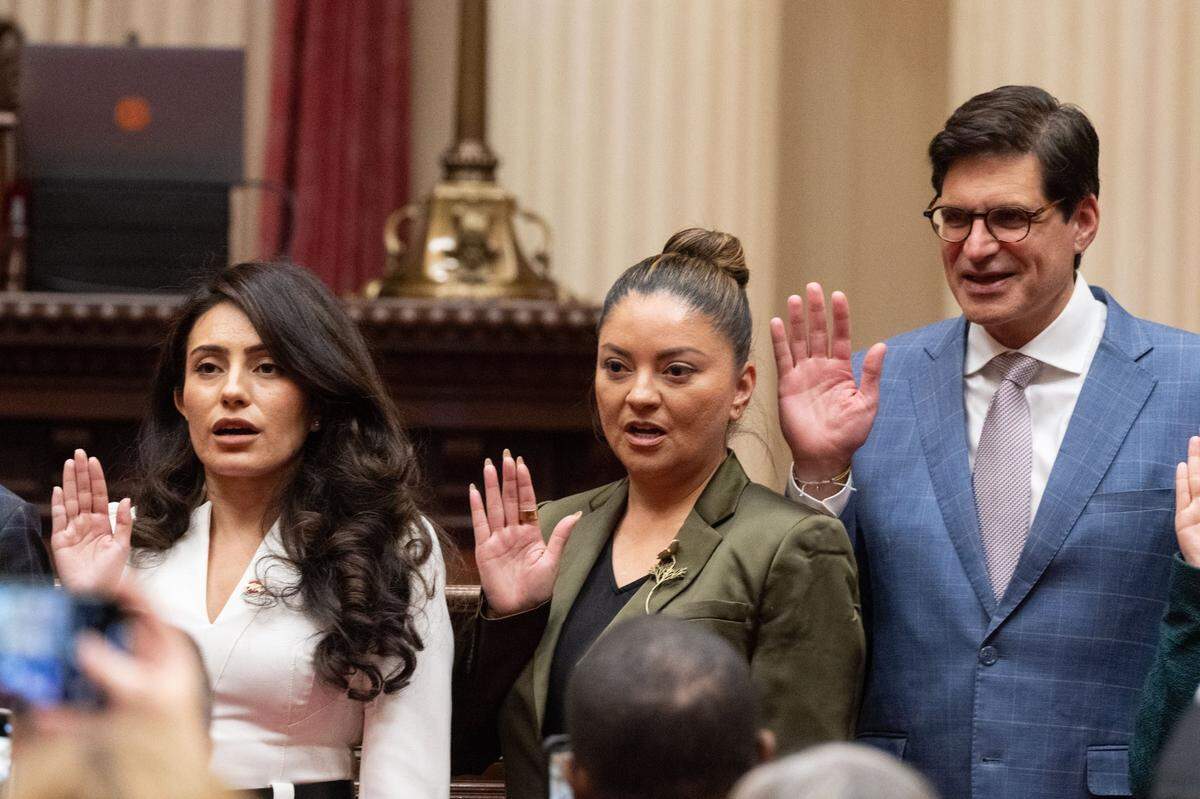 State Sens. Sasha Renée Pérez, D-Alhambra, Lena Gonzalez, D-Long Beach, and Josh Becker, D-Menlo Park, are sworn in during the first meeting of the session on Monday at the state Capitol. Gonzalez, the Senate Majority Leader, also chairs the California Legislative Latino Caucus.