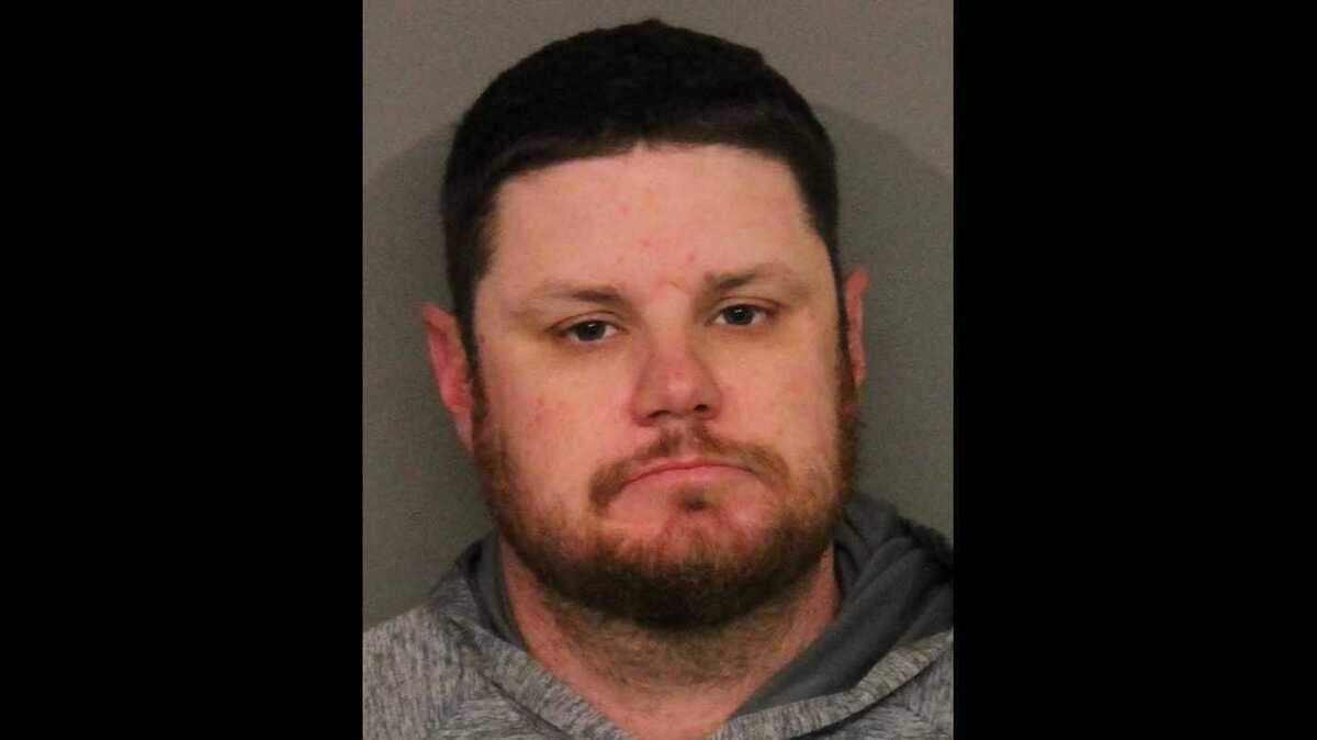 James Brian Rhodes, 38, seen in a booking photo released Saturday, February 15, 2020, was arrested after Roseville Police detectives determined he had been having an unlawful sexual relationship with at least one minor on a Rancho Cordova-based youth team he coached.