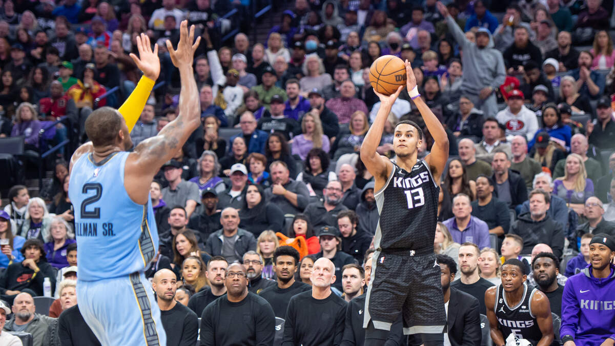 Sacramento Kings forward Keegan Murray (13) shoots a jumper over Memphis Grizzlies forward Xavier Tillman (2) in the second half in the NBA basketball game Monday, Jan. 23, 2023, at the Golden 1 Center in Sacramento. Murray had 20 points and nine rebounds. The Kings win 133-100.