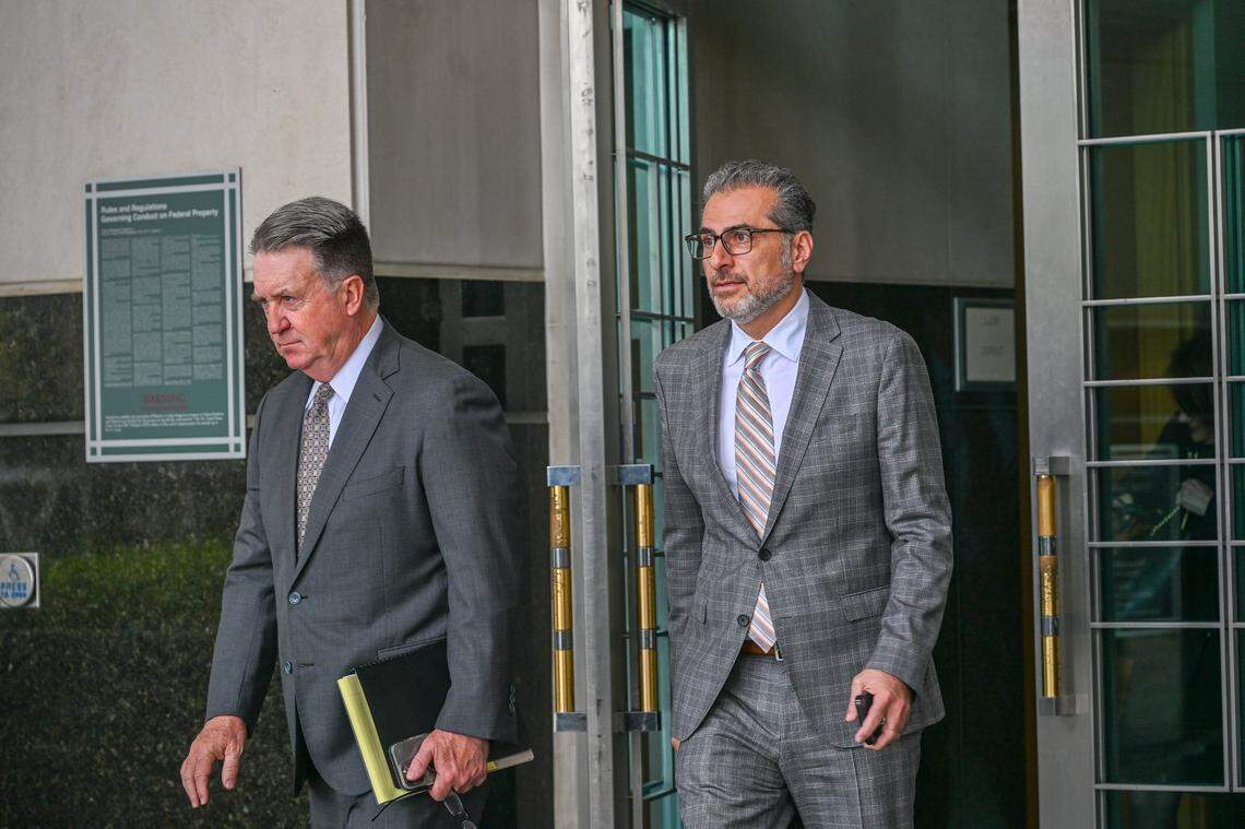 Former Sacramento Councilmember Sean Loloee, right, leaves the Robert T. Matsui U.S. Courthouse after an arraignment in Sacramento on March 22, 2024. He is set to plead guilty to federal charges Thursday.