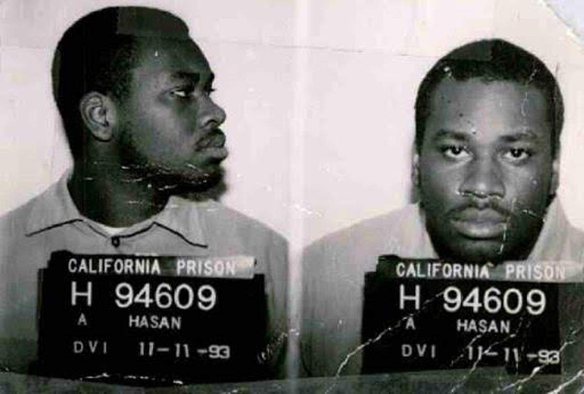 A mugshot of a young Julius Thibodeaux, who also went by the name Ahmad Hasan.