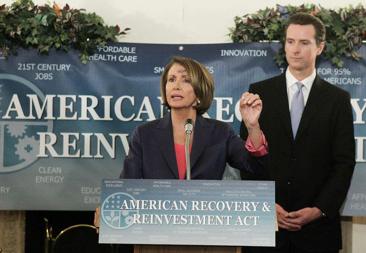 San Francisco Mayor Gavin Newsom looks on as U.S. Speaker of the House Nancy Pelosi speaks during a news conference following a American Recovery Act anniversary roundtable on Feb. 17, 2010, in San Francisco.