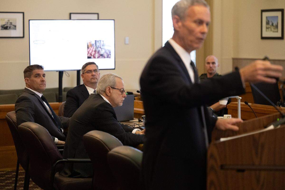 Daniel Serafini, the former major league baseball player who is on trial for the murder of his in-laws, listens to the opening arguments by Richard Miller, assistant chief deputy district attorney, with his attorneys David Dratman and David Fischer in Placer Superior Court in Auburn on Monday.
