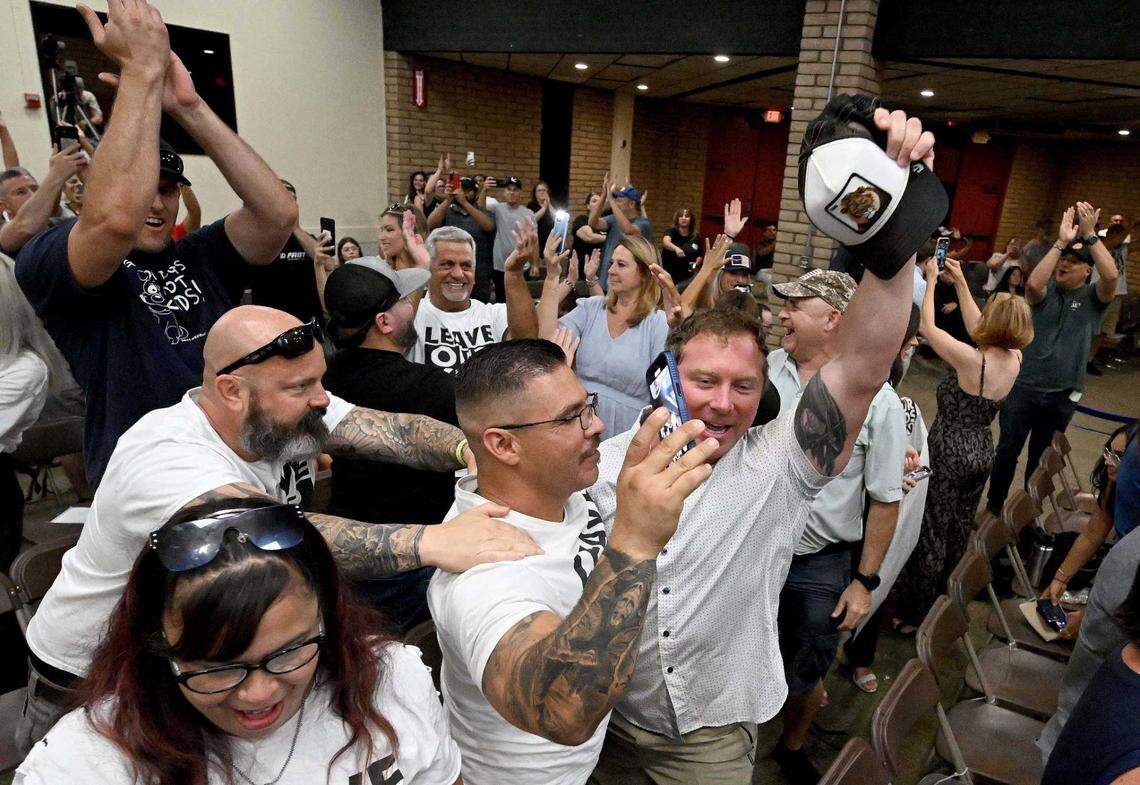 Supports of parents rights celebrate after the Chino Valley Unified School District voted 4-1 on a policy requiring schools to notify parents if their child changes their pronouns Thursday at Don Lugo High School in Chino.