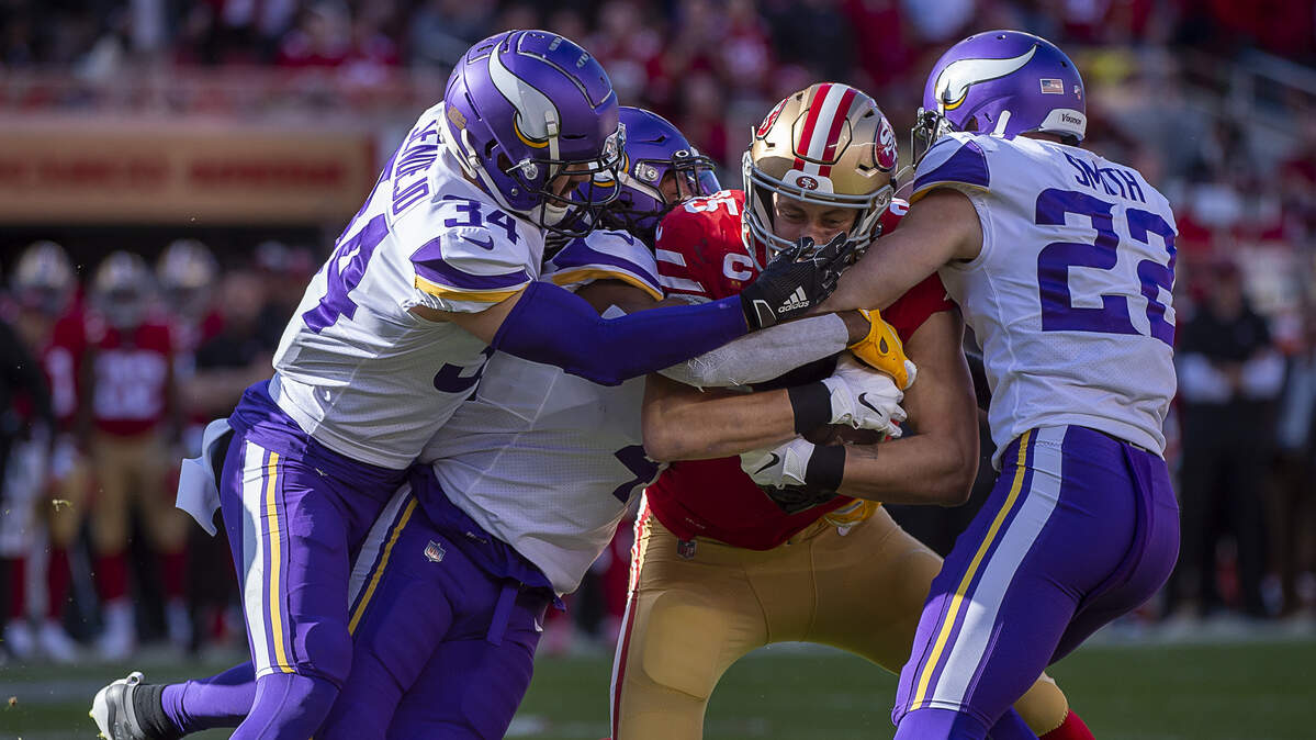 San Francisco 49ers tight end George Kittle (85) is tackled by Minnesota Vikings strong safety Andrew Sendejo (34), Minnesota Vikings free safety Harrison Smith (22) and Minnesota Vikings defensive back Anthony Harris (41) in the first quarter during an NFC playoff game at the Levi’s Stadium on Saturday, Jan 11, 2020 in Santa Clara.