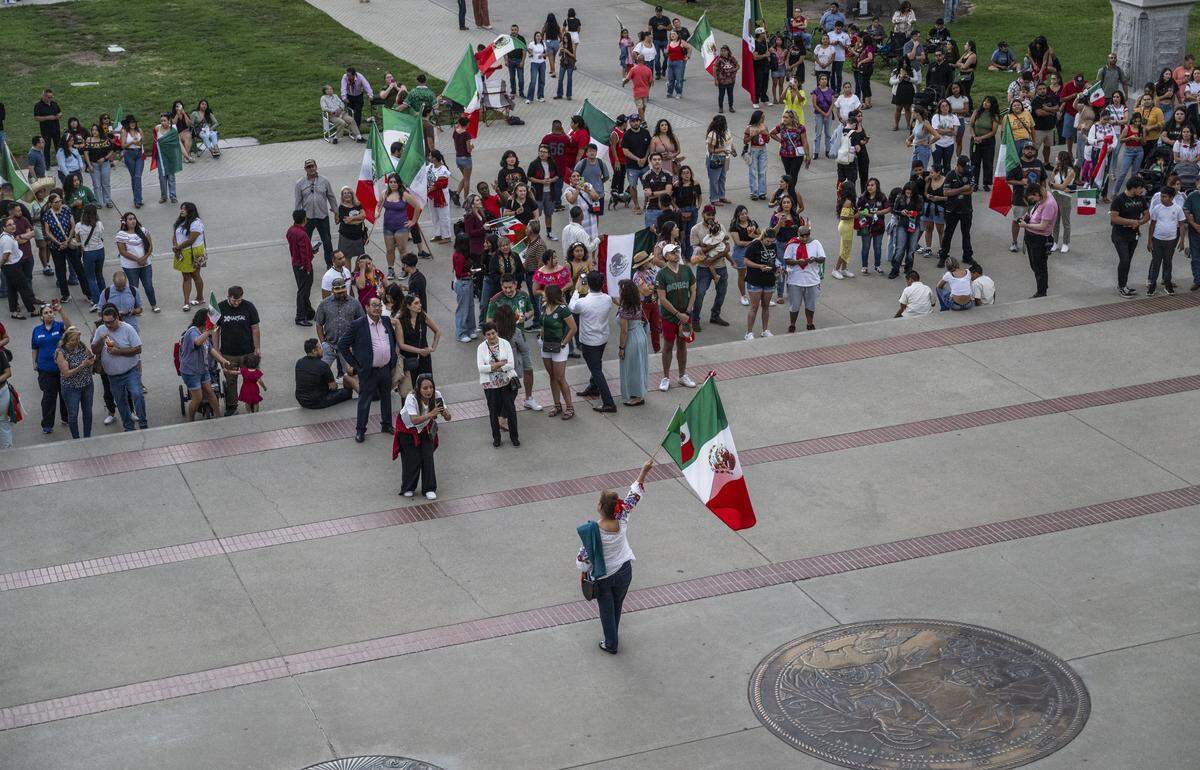 A smaller than usual crowd celebrates Mexican Independence Day at the state Capitol on Monday. The event, which can normally count on attendance in the thousands, drew a few hundred people this year amid the federal crackdown on immigration. 