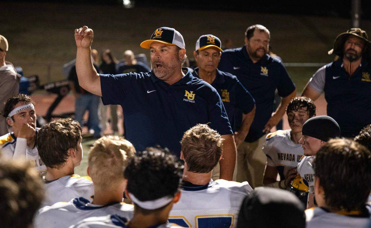 Nevada Union coach Brad Sparks speaks to his team after it defeated Del Campo in Carmichael on Friday.