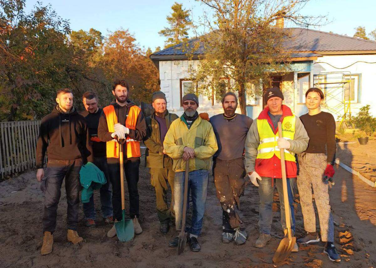 The author poses with his fellow Dobrobat crew, a volunteer construction group.