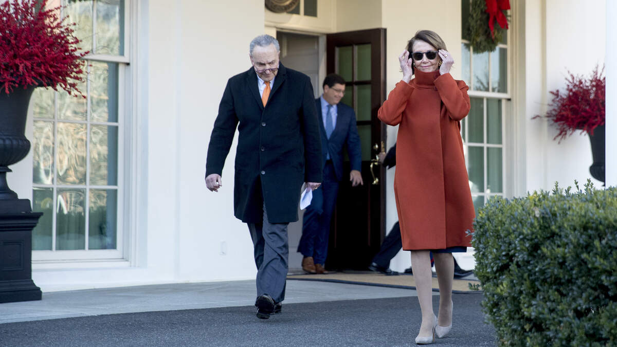 House Minority Leader Nancy Pelosi of Calif., right, and Senate Minority Leader Sen. Chuck Schumer of N.Y., left, walk out of the West Wing to speak to members of the media outside of the White House in Washington, Tuesday, Dec. 11, 2018, following a meeting with President Donald Trump. (AP Photo/Andrew Harnik)