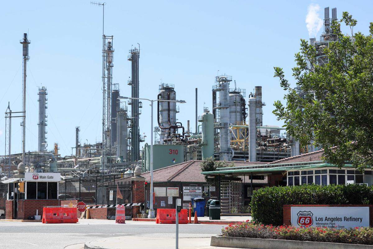 The main gate of the Phillips 66 refinery is seen Aug. 29, 2025, in the Wilmington neighborhood of Los Angeles. The refinery is scheduled to close in December, one of two shutdowns expected to tighten supply as California begins allowing sales of E15 gasoline under a new law intended to ease prices.