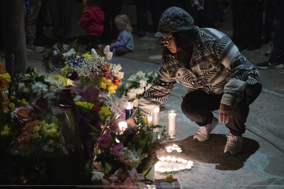 Neighbors light candles during a vigil on Mill Water Circle in Rancho Cordova on Sunday, Feb. 1, 2026, to remember the Vallerga family who were found dead in their home on the street on Jan. 27 in an apparent murder-suicide.