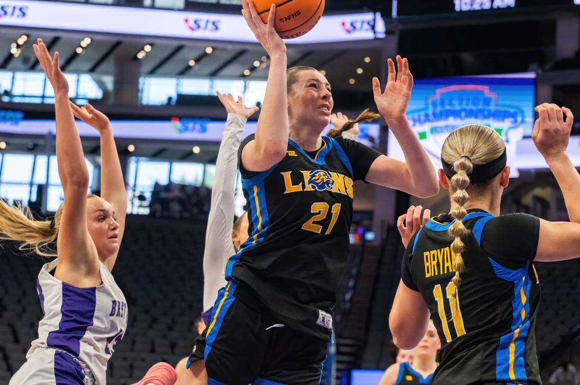 Faith Christian Lions guard Presley Berry (21) goes to the basket against the Bret Harte Bullfrogs in the CiF Sac-Joaquin Section Division V girls basketball championship at Golden 1 Center on Saturday.