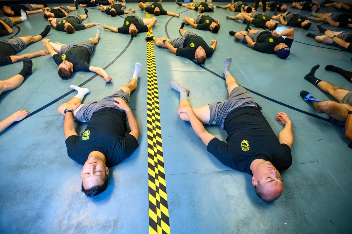 Cal Fire cadets participate in a yoga and meditation class as part of an effort to provide more focus on stress relief, Thursday, Nov. 7, 2019, at the Cal Fire Training Center in Ione.