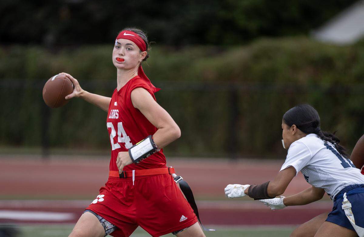The McClatchy Lions' Daisy Throckmorton (24) throws downfield against the West Park Panthers during a flag football game on Wednesday, Sept. 24, in Sacramento.