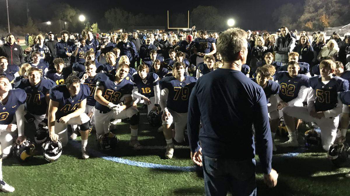 Oak Ridge players listen to their postgame talk Friday after earning a spot in the Sac-Joaquin Section Division I championship game.