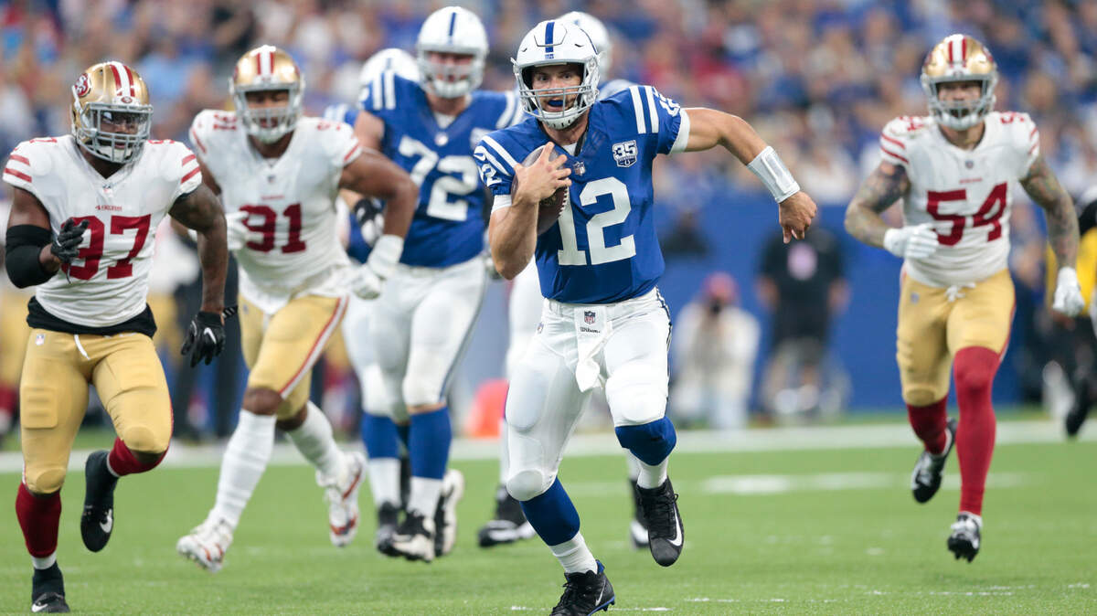 Indianapolis Colts quarterback Andrew Luck (12) scrambles away from 49ers linebacker Dekoda Watson (97), defensive end Arik Armstead (91) and defensive end Cassius Marsh (54) in the first half of an NFL preseason football game in Indianapolis, Saturday, Aug. 25, 2018.