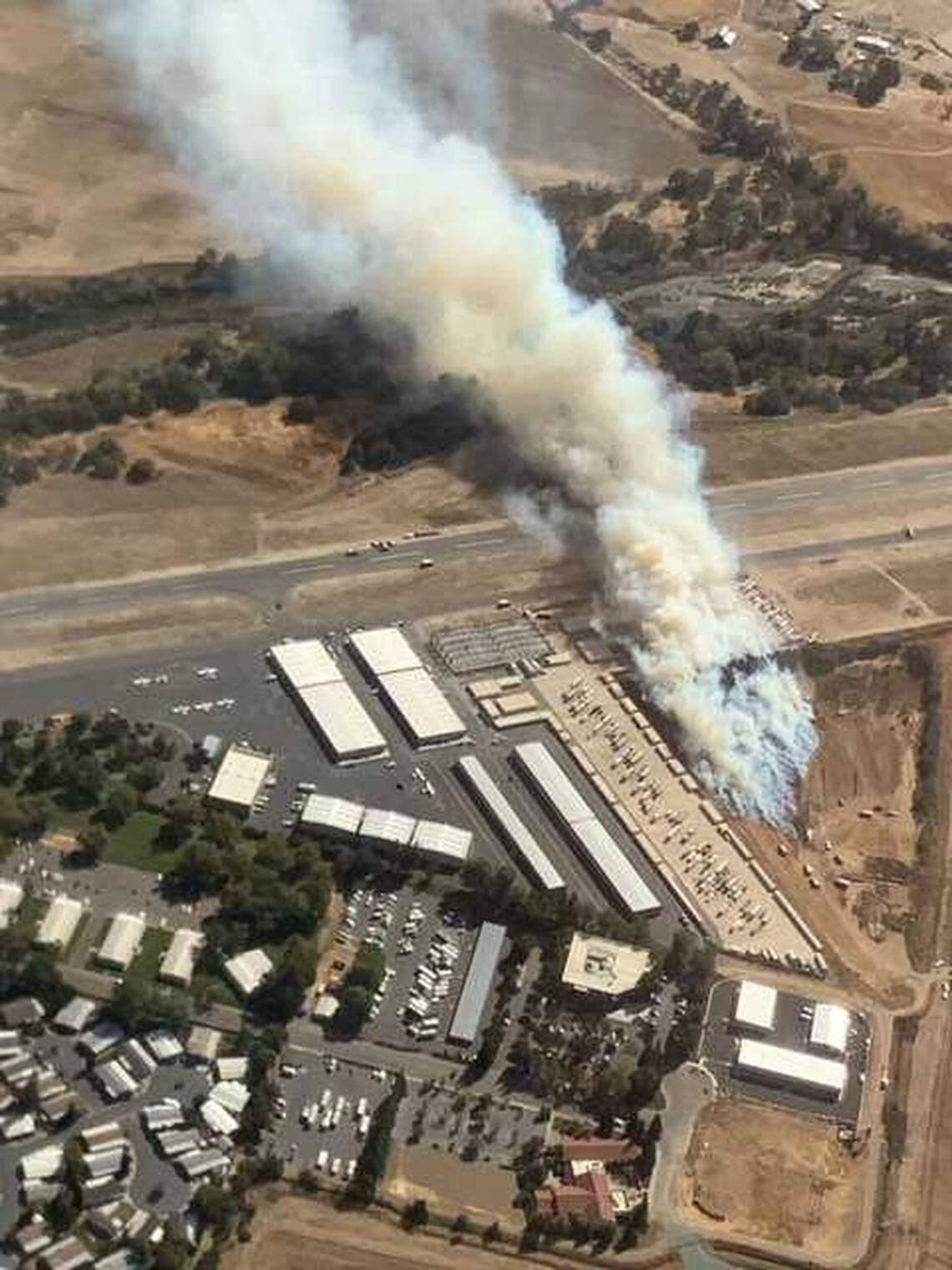 A wind-driven grass fire burned several acres and pushed flames against the runway at the Rancho Murieta Airport on Monday Oct. 11, 2021, in Rancho Murieta, California.