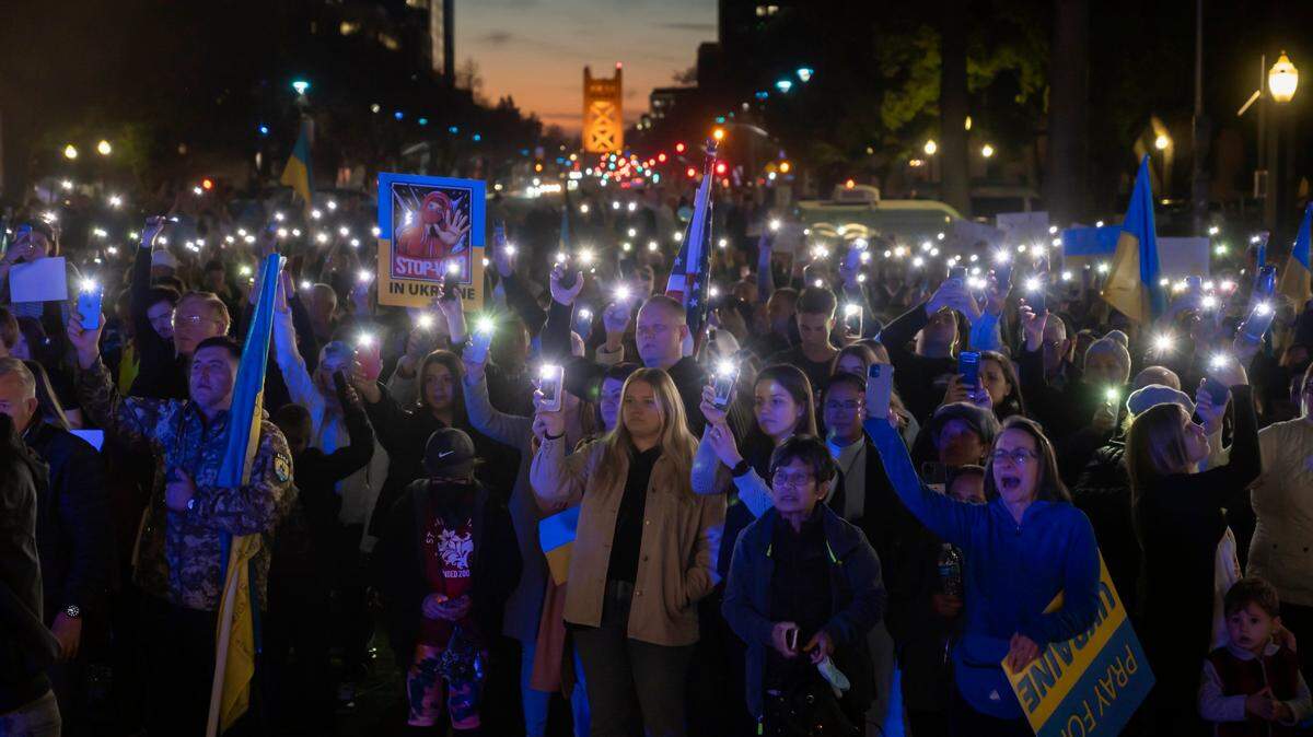 More than 1,000 protesters light up their cell phones for Ukraine during the prayer rally on Sunday, Feb. 27, 2022, at the state Capitol in Sacramento.