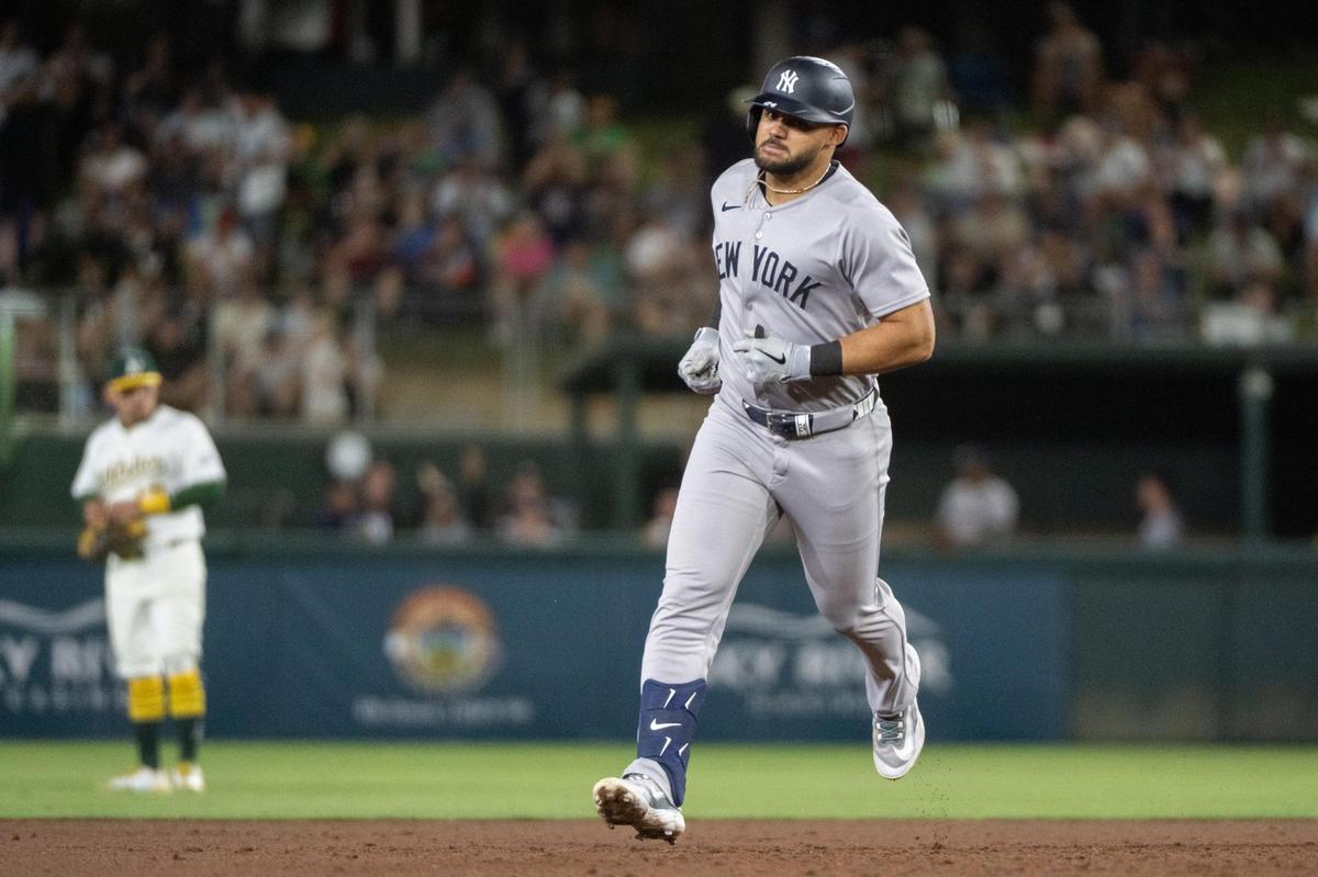 New York Yankees outfielder Jasson Domínguez (24) rounds the bases after his grand slam in the eighth inning and third home run of the game against the Athletics at Sutter Health Park on Friday in West Sacramento.