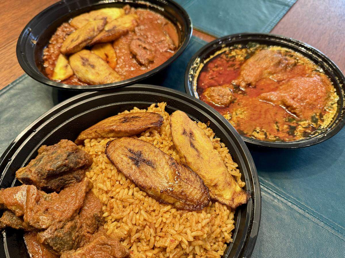 Jollof rice, egusi soup with fufu and beans and goat from Nigerian restaurant Naija Cuisine