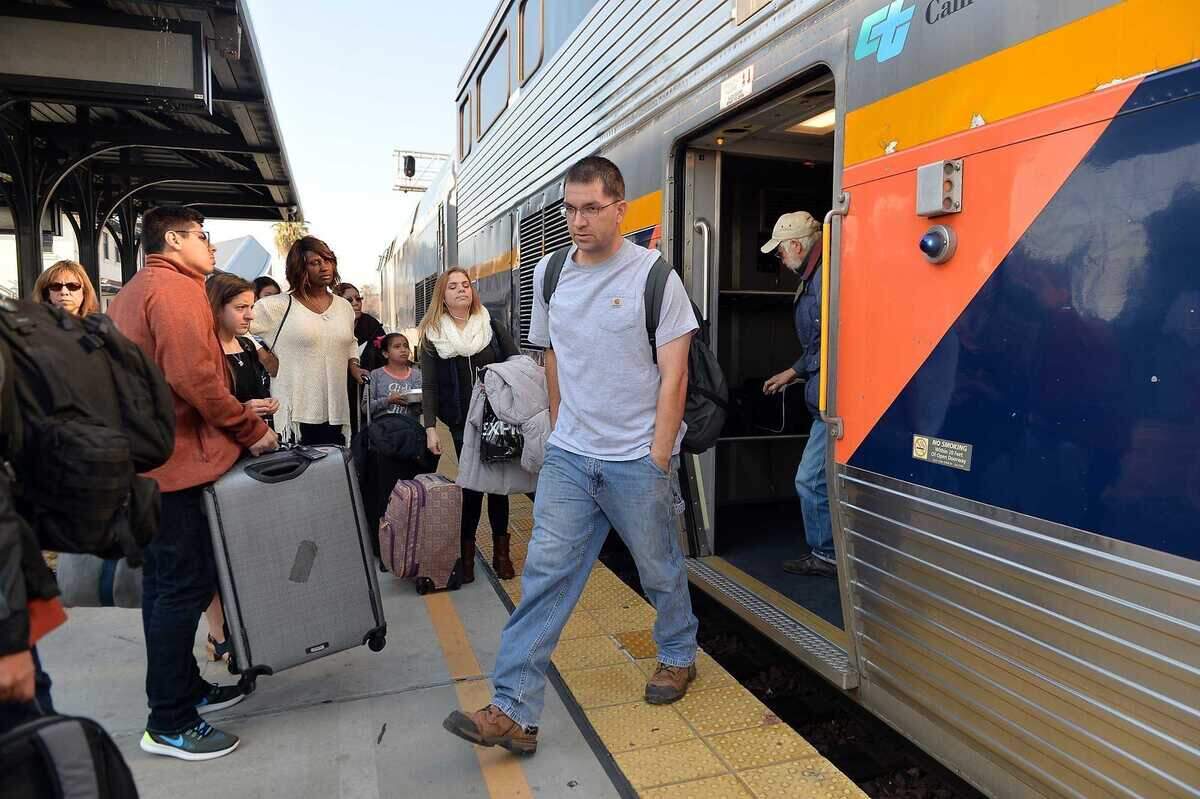 Passengers wait to board as the Amtrak San Joaquins train arrives in Fresno in 2016. The trains will stop at a new Elk Grove train station planned for Dwight Road near Laguna Boulevard.