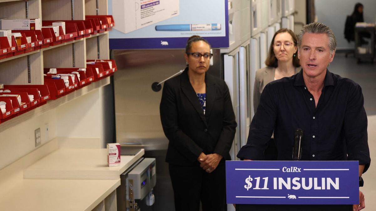 Gov. Gavin Newsom speaks during a news conference announcing $11 insulin and prescription drugs with the CalRx program inside a Cedars-Sinai pharmacy in Los Angeles on Thursday. The effort is part of Newsom’s effort to lower prescription drug costs by producing generics.