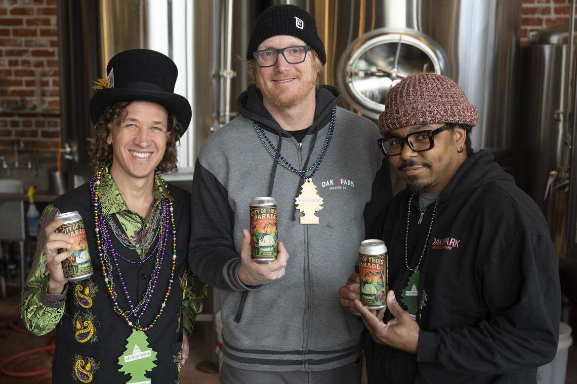 Wes Samms, lead organizer of the City of Trees Parade, left, poses for a portrait with Geoff Scott and Rodg Little, co-owners and brewers at Oak Park Brewing, at the brewery in Sacramento on Feb. 19. The brewery and parade organizers collaborated to create a special beer for the parade.