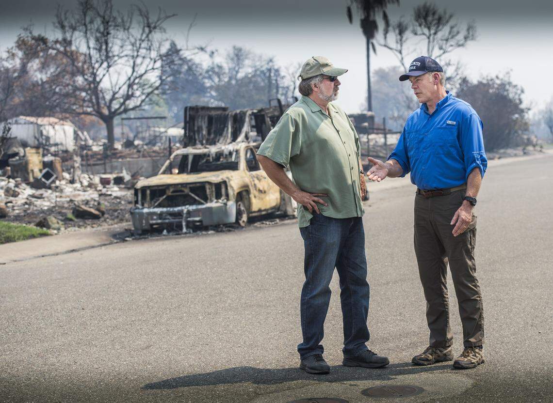 Congressman Doug LaMalfa, left, talks with Secretary of Interior Ryan Zinke at Keswick Estates in Redding in 2018 after the Carr Fire. 