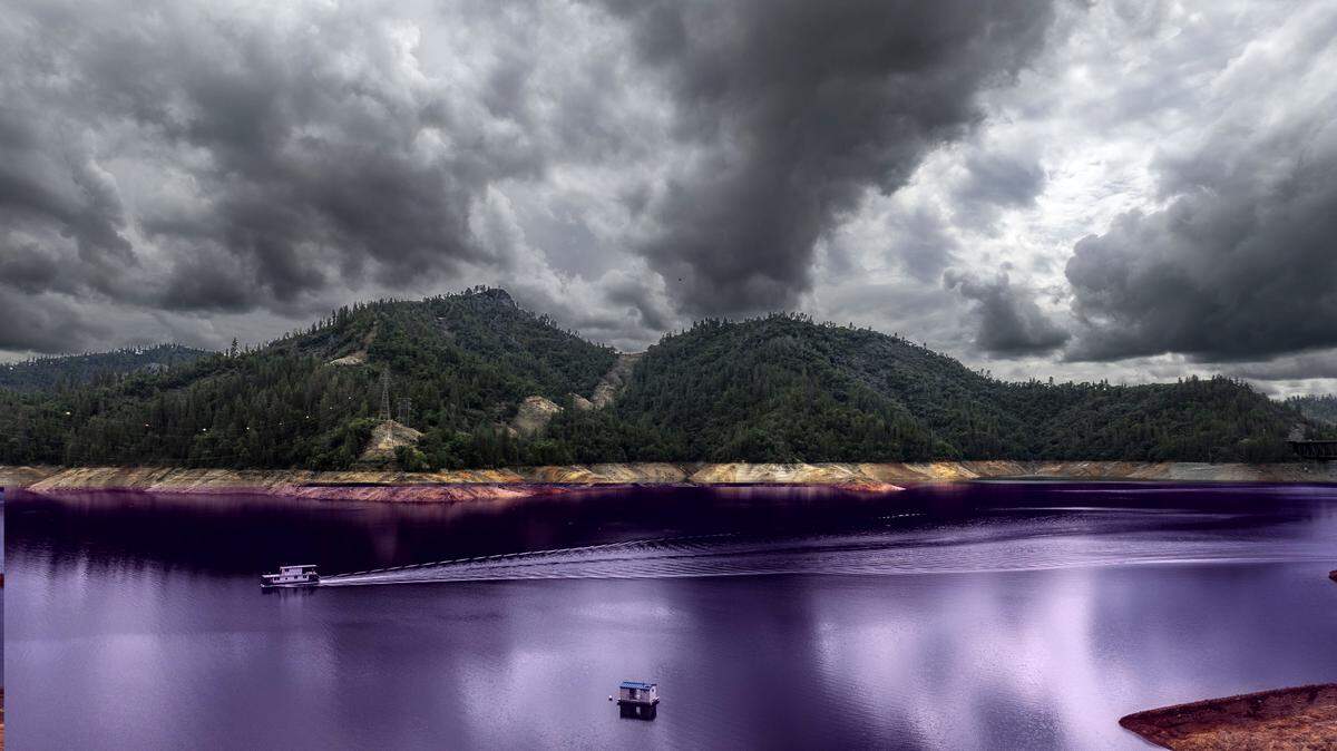 A house boat travels on Shasta Lake on Oct. 2.