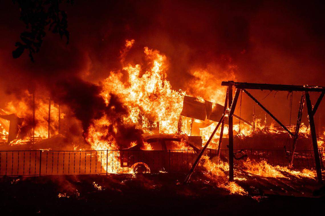 A home burns during the Bear fire, part of the North Lightning Complex fires in the Berry Creek area of unincorporated Butte County, California on September 9, 2020. Dangerous dry winds whipped up California’s record-breaking wildfires and ignited new blazes, as hundreds were evacuated by helicopter and tens of thousands were plunged into darkness by power outages across the western United States.