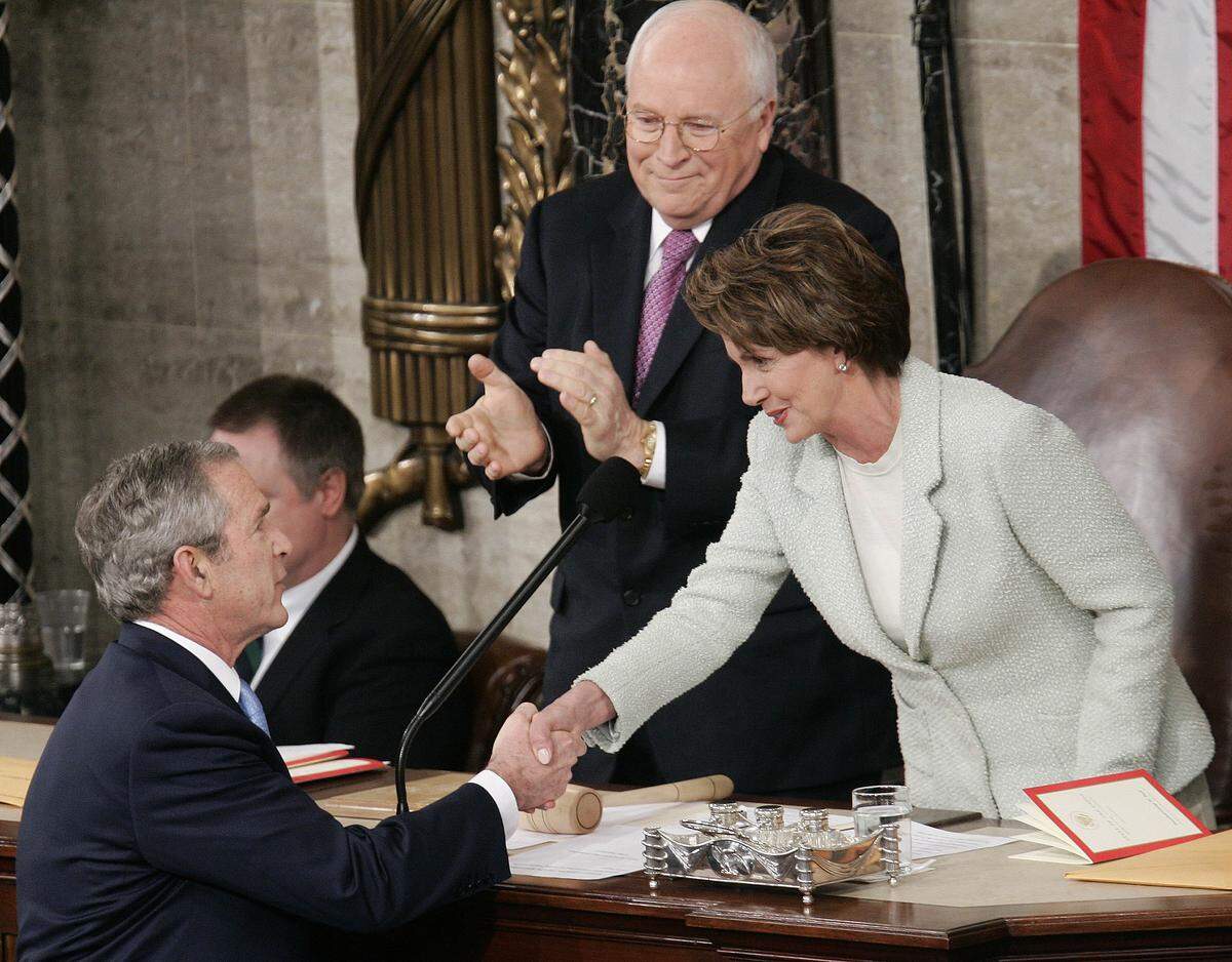 U.S. President George W. Bush shakes hands with Speaker of the House Nancy Pelosi, D-Calif., as Vice President Dick Cheney looks on after Bush delivered his State of the Union address at the U.S. Capitol on Jan. 23, 2007.