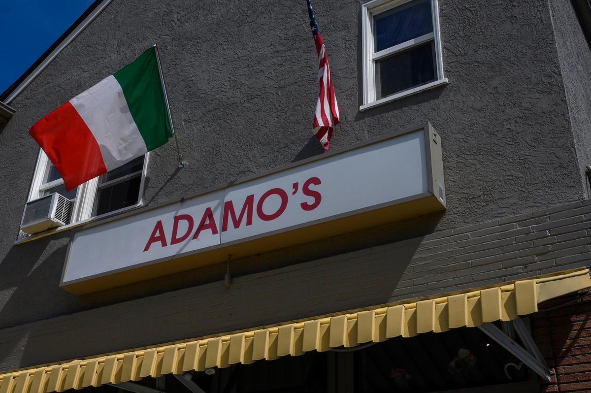 The Italian flag blows in the wind outside Adamo’s Kitchen on Tuesday, April 23, 2019 in Sacramento.