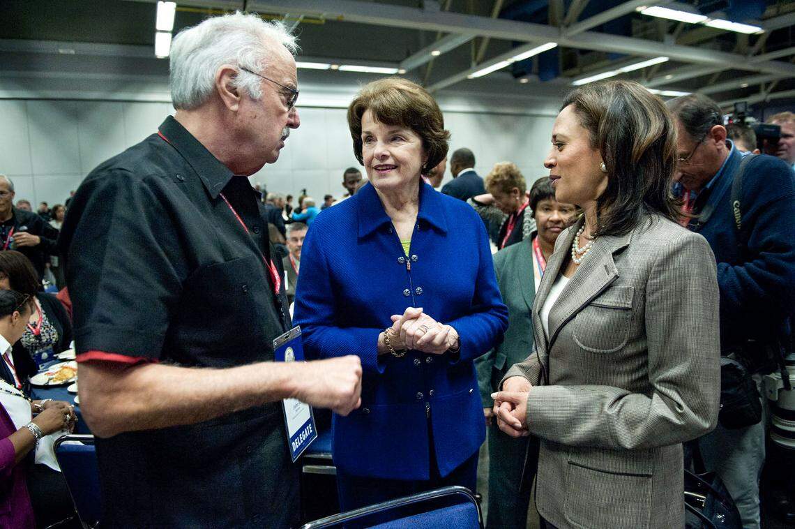 California Democratic Party Chairman John Burton, left, talks with Sen. Dianne Feinstein and Attorney General Kamala Harris after her remarks to Democratic delegates in April 2011 at the Sacramento Convention Center.