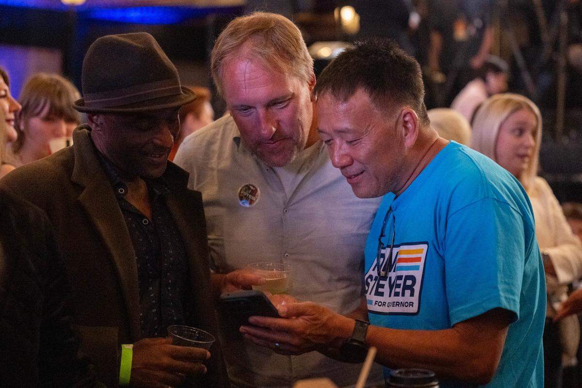 Supporters of California gubernatorial candidate Tom Steyer look at results during an election night watch party at the Regency Ballroom in San Francisco on Tuesday, June 2, 2026.