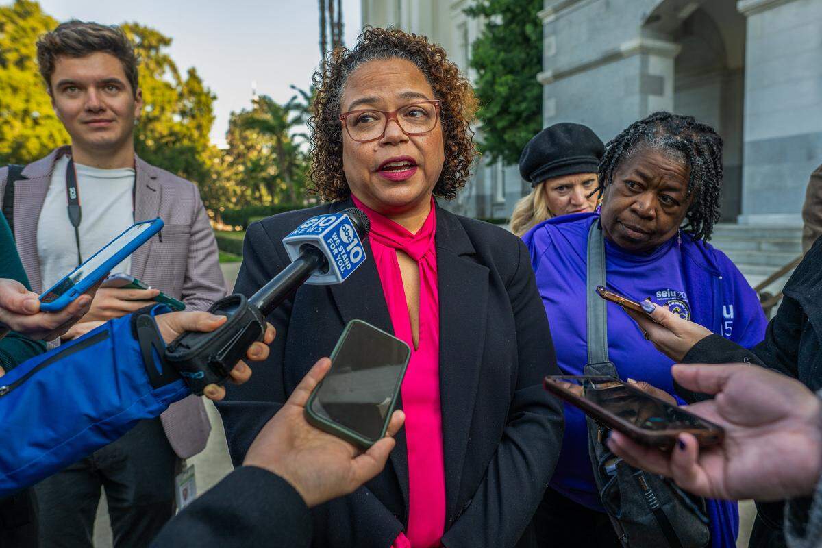 Assemblymember Mia Bonta, chair of the Assembly Health Committee, answers questions from the media after speaking at a “Fight for Our Health” rally at the state Capitol on Jan. 14 in Sacramento.