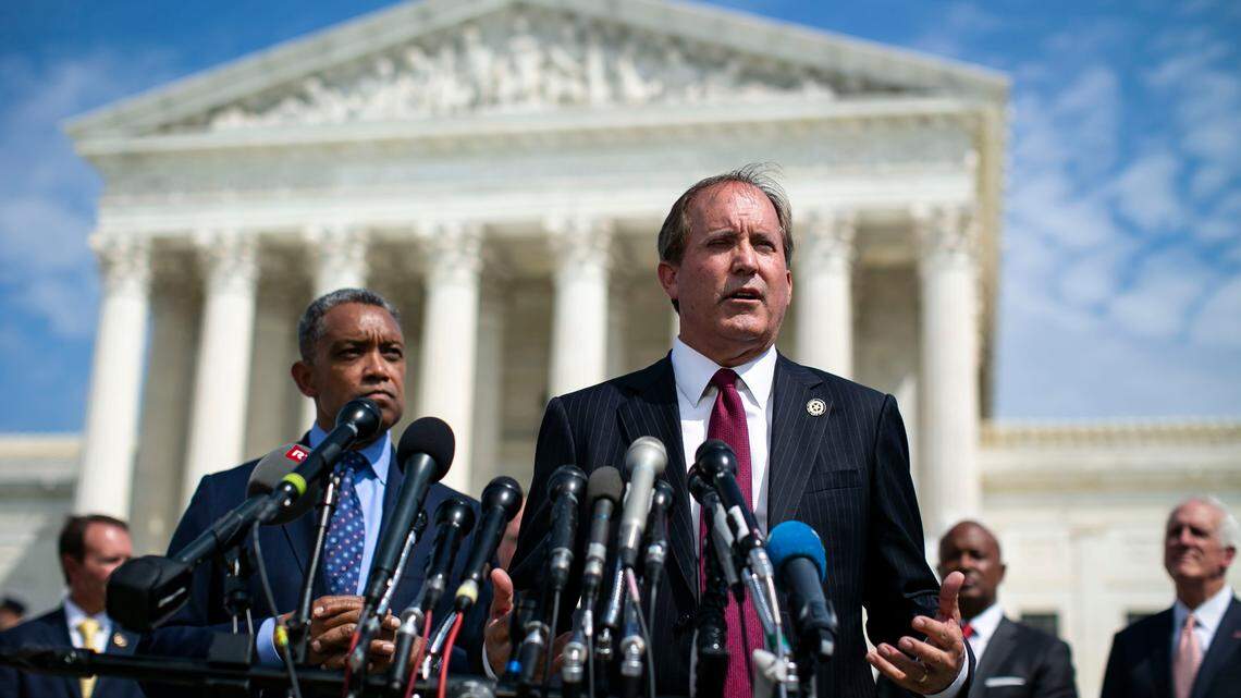 FILE -- Texas Attorney General Ken Paxton speaks at a news conference as District of Columbia Attorney General Karl Racine, left, and other state attorneys general look on, outside the Supreme Court in Washington, Sept. 9, 2019. In a petition filed on Oct. 31 in Texas state court of Travis County, Google, along with its parent company Alphabet, sought a protective order against Paxton, who is spearheading the multistate antitrust investigation into the company. (Al Drago/The New York Times)