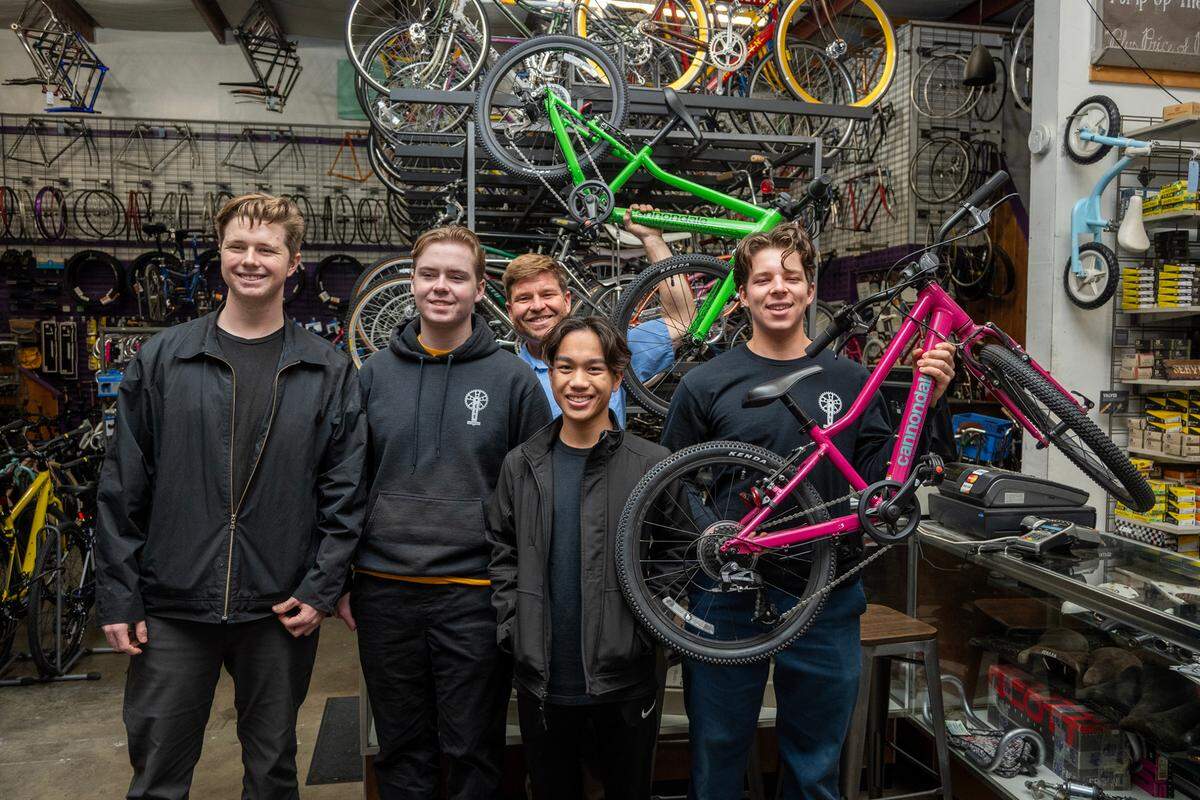 Owen Wilber, 17, left, Rowan Diepenbrock, 19, Riley Domine, 17, and Winston Holtkamp, 17, right, of Boys 4 Bikes stand with Jeff Dzurinko of the Sutterville Bicycle Company, rear, to pick up 40 bikes Friday, Dec. 8. They started Boys 4 Bikes when they were in elementary school, raising money to buy bikes to be distributed to underprivileged youth. They’re asking readers of Book of Dreams for $5,000 to help continue their mission.