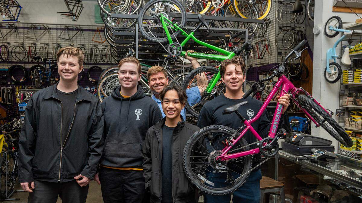 Owen Wilber, 17, left, Rowan Diepenbrock, 19, Riley Domine, 17, and Winston Holtkamp, 17, right, of Boys 4 Bikes stand with Jeff Dzurinko of the Sutterville Bicycle Company, rear, to pick up 40 bikes Friday, Dec. 8. They started Boys 4 Bikes when they were in elementary school, raising money to buy bikes to be distributed to underprivileged youth. They’re asking readers of Book of Dreams for $5,000 to help continue their mission.