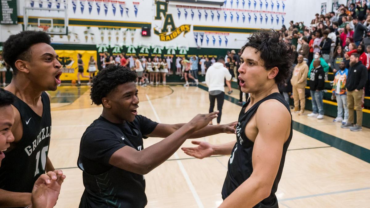 Granite Bay Grizzlies guard/forward Yaqub Mir, right, is congratulated by teammates after their win over the Rio Americano Raiders in the CIF Sac-Joaquin Section Division II high school boys basketball semifinal game Wednesday at Rio Americano High School in Arden Arcade. The Grizzlies held off a Raiders comeback in the second half for the win, 58-56, and head to the section final against Whitney on Friday at Golden 1 Center.