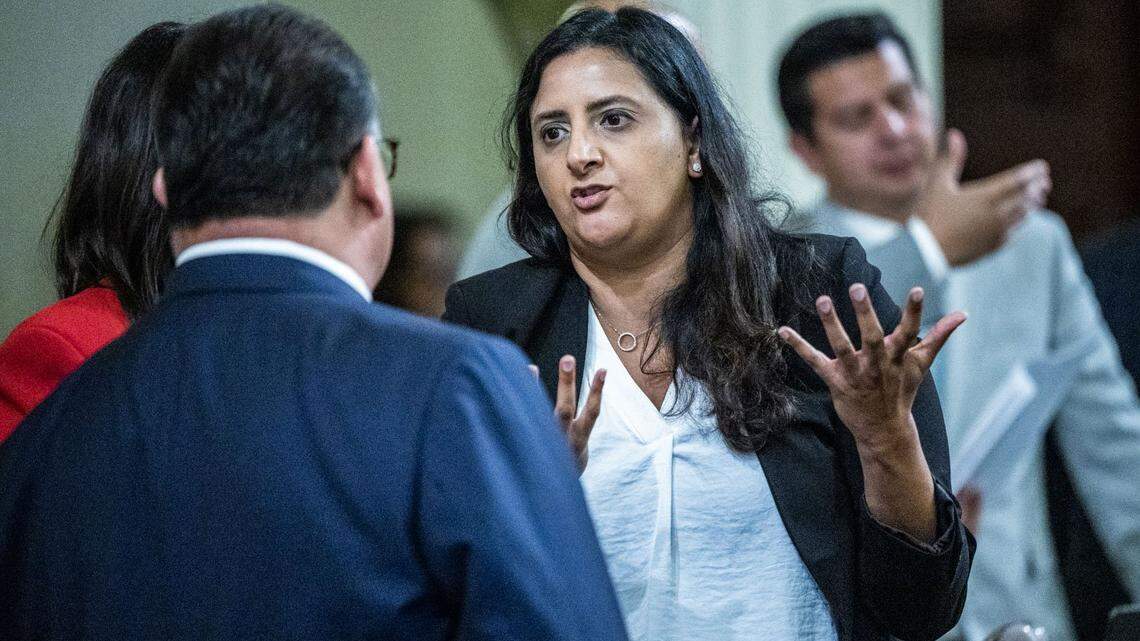 Assemblymember Jasmeet Bains, D-Delano, talks with colleagues during session in 2023.