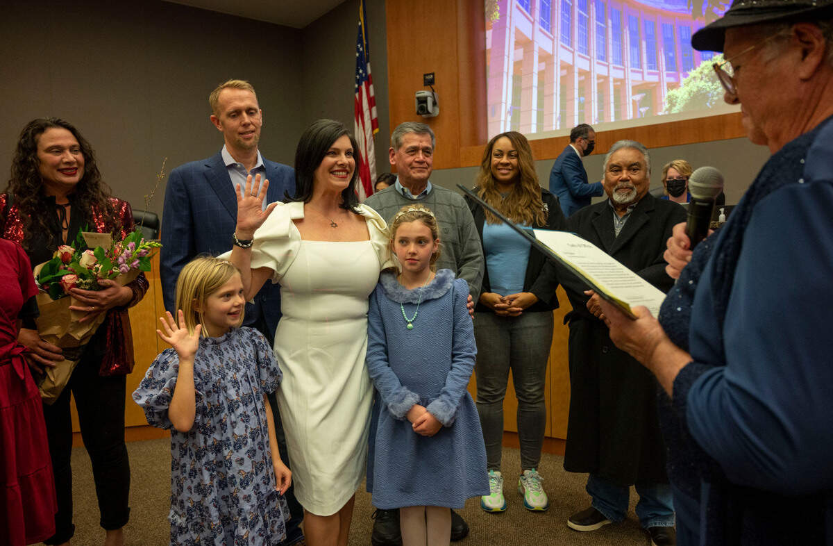 Lisa Kaplan, center, is sworn in as a Sacramento City Council member by her mother Kathy Kaplan, as she stands with her family and supporters, including her daughters Viva and Asha and husband B.G. Heiland, on Tuesday at City Hall.